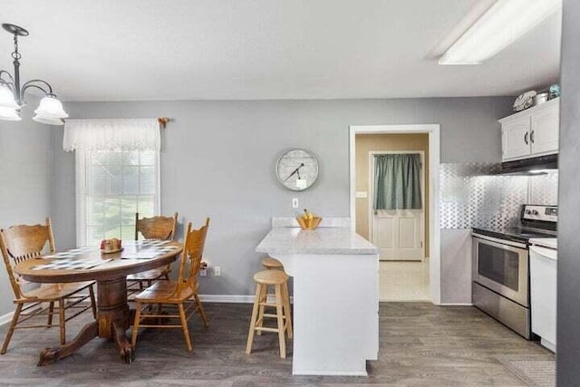346 Thomas Rd, Benton, TN 37307 - dining space with a chandelier and wood finished floors