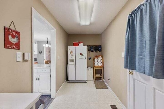 346 Thomas Rd, Benton, TN 37307 - washroom with a chandelier and light floors