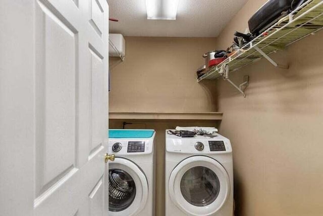 346 Thomas Rd, Benton, TN 37307 - washroom with washing machine and clothes dryer