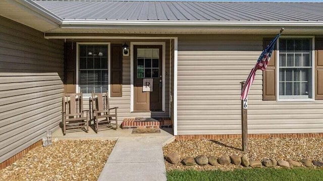 346 Thomas Rd, Benton, TN 37307 - view of exterior entry with a metal roof