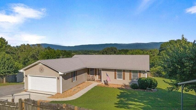 346 Thomas Rd, Benton, TN 37307 - ranch-style house with concrete driveway, a garage, and a mountain view
