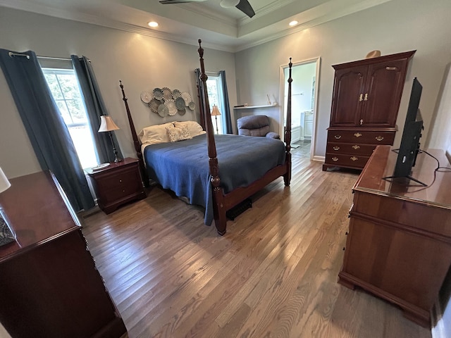 7901 Hamilton Mill Dr, Chattanooga, TN 37421 - bedroom with crown molding, light wood-type flooring, a raised ceiling, and connected bathroom