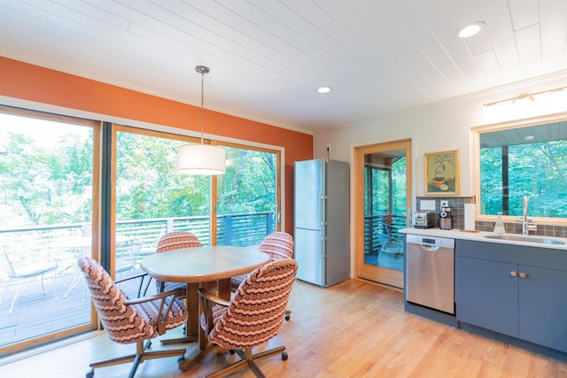 4205 Seneca Ave, Chattanooga, TN 37409 - kitchen featuring appliances with stainless steel finishes, healthy amount of natural light, light countertops, recessed lighting, and light wood-style flooring