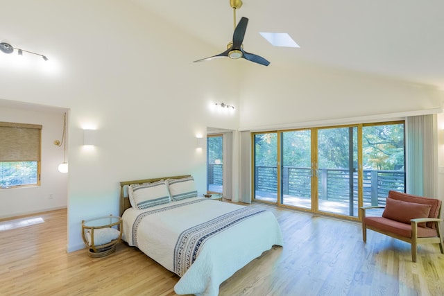 4205 Seneca Ave, Chattanooga, TN 37409 - bedroom with access to exterior, high vaulted ceiling, light wood finished floors, and a skylight