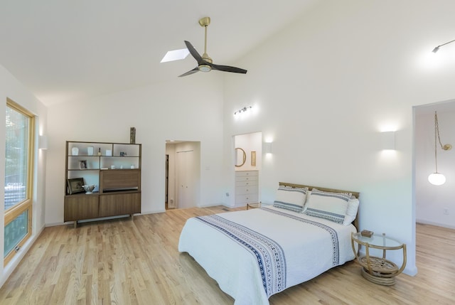 4205 Seneca Ave, Chattanooga, TN 37409 - bedroom with wood finished floors, high vaulted ceiling, a skylight, and a ceiling fan