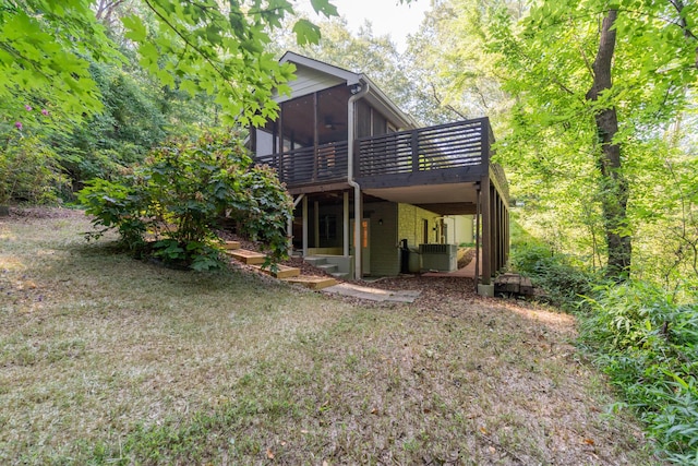 4205 Seneca Ave, Chattanooga, TN 37409 - back of house featuring a sunroom and a wooden deck
