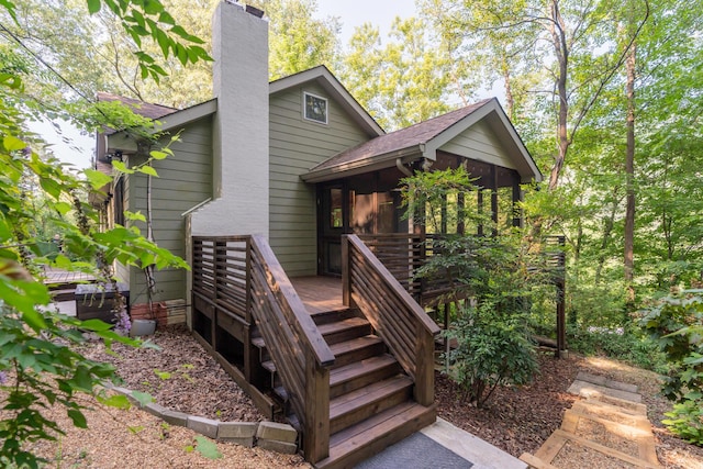 4205 Seneca Ave, Chattanooga, TN 37409 - rear view of house with a chimney, stairway, a deck, a sunroom, and roof with shingles