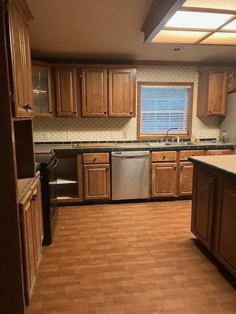 287 E Teems Rd, Ringgold, GA 30736 - kitchen featuring dishwasher, light wood-type flooring, black range with electric cooktop, and glass insert cabinets