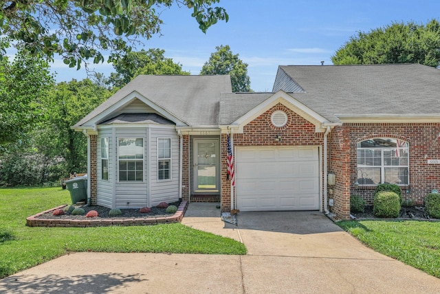 6661 Hickory Trace Cir, Chattanooga, TN 37421 - view of front of home with a garage, driveway, a front lawn, brick siding, and roof with shingles