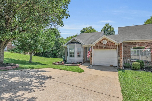 6661 Hickory Trace Cir, Chattanooga, TN 37421 - view of front of house with driveway, an attached garage, brick siding, a front lawn, and roof with shingles