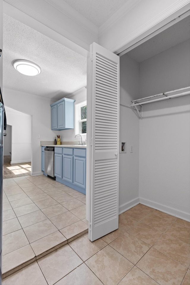 5014 Carolyn Ln, Chattanooga, TN 37411 - washroom featuring washer hookup, light tile patterned floors, a textured ceiling, and ornamental molding