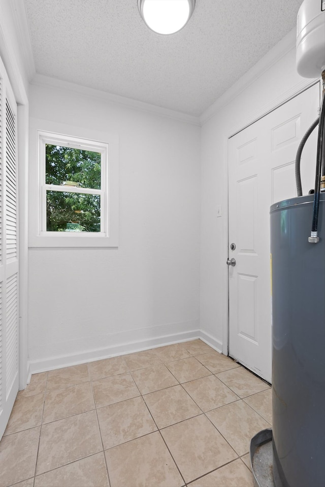 5014 Carolyn Ln, Chattanooga, TN 37411 - laundry room with water heater, crown molding, a textured ceiling, and light tile patterned flooring