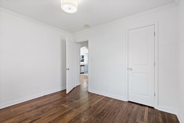 5014 Carolyn Ln, Chattanooga, TN 37411 - unfurnished bedroom with ornamental molding, dark wood-style flooring, and arched walkways