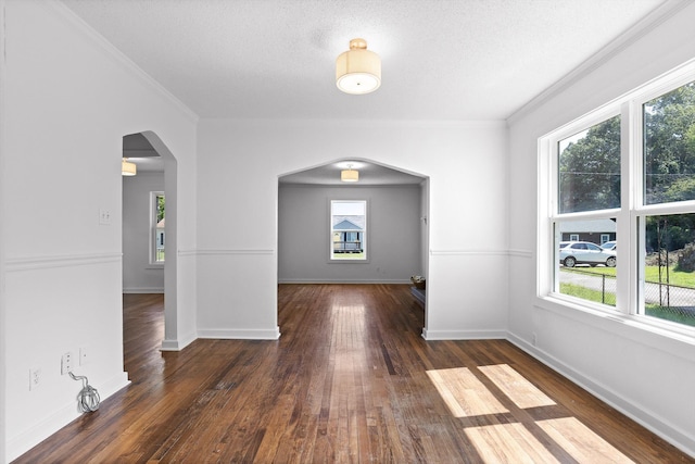 5014 Carolyn Ln, Chattanooga, TN 37411 - unfurnished room featuring arched walkways, plenty of natural light, hardwood / wood-style floors, and crown molding