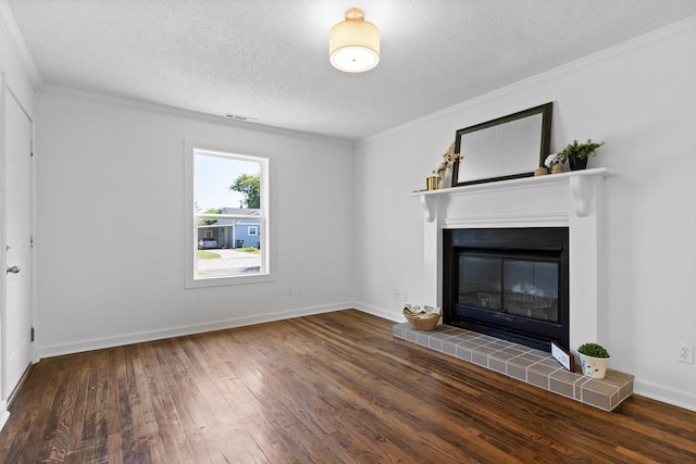 5014 Carolyn Ln, Chattanooga, TN 37411 - unfurnished living room featuring a textured ceiling, hardwood / wood-style floors, ornamental molding, and a tiled fireplace