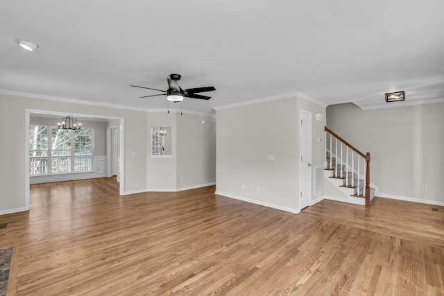 5586 Crooked Creek Dr, Ooltewah, TN 37363 - unfurnished living room featuring light wood-style flooring, ceiling fan, a chandelier, stairway, and ornamental molding
