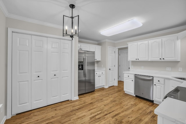 5586 Crooked Creek Dr, Ooltewah, TN 37363 - kitchen featuring stainless steel appliances, ornamental molding, light wood-style flooring, white cabinets, and decorative light fixtures