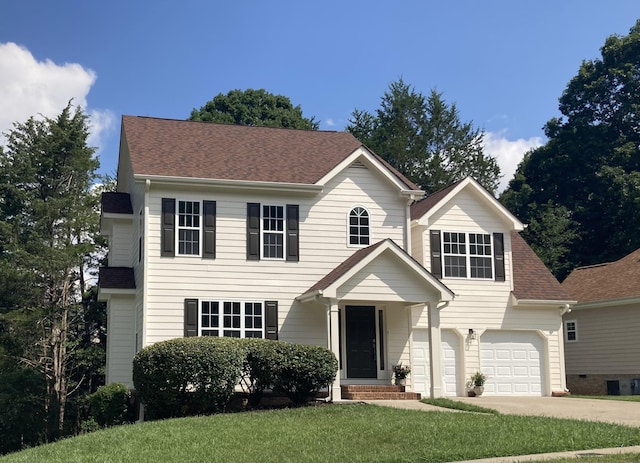 5586 Crooked Creek Dr, Ooltewah, TN 37363 - view of front of house with an attached garage, driveway, a front yard, and roof with shingles