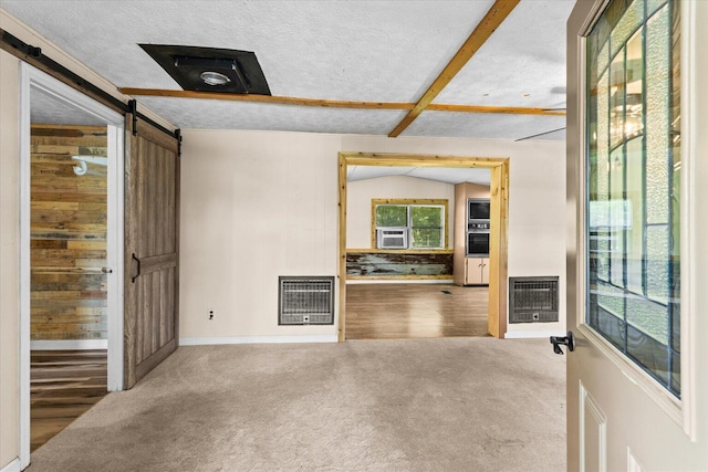 4621 Bramblett Dr SE, Dalton, GA 30721 - unfurnished room featuring heating unit, a barn door, and carpet floors