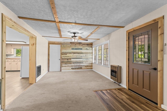 4621 Bramblett Dr SE, Dalton, GA 30721 - foyer featuring heating unit, wooden walls, ceiling fan, a textured ceiling, and carpet