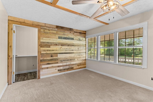 4621 Bramblett Dr SE, Dalton, GA 30721 - carpeted spare room featuring wooden walls, a ceiling fan, and a textured ceiling