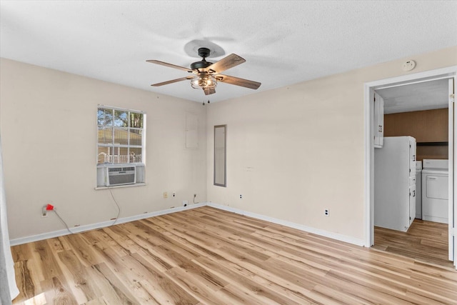 4621 Bramblett Dr SE, Dalton, GA 30721 - spare room with light wood finished floors, ceiling fan, a textured ceiling, washing machine and clothes dryer, and cooling unit
