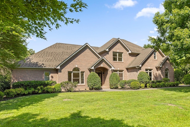 9539 Shadow Crossing Ln, Chattanooga, TN 37421 - view of front of property with brick siding, a front yard, and a shingled roof