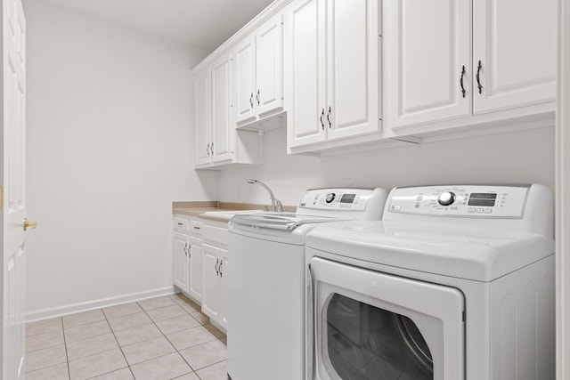 9539 Shadow Crossing Ln, Chattanooga, TN 37421 - laundry room with cabinet space, washing machine and clothes dryer, and light tile patterned floors