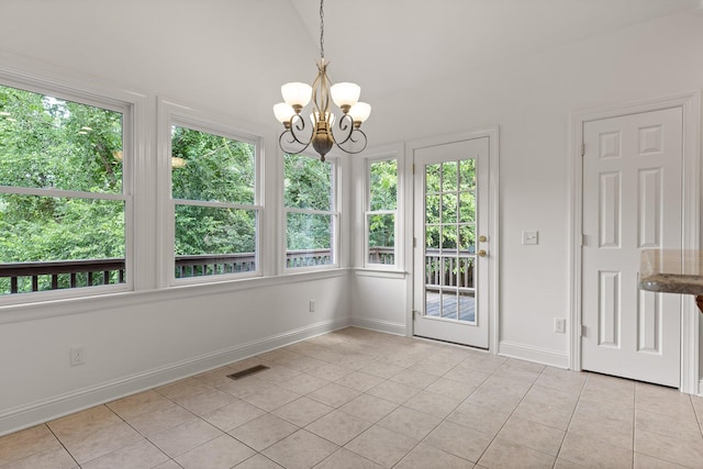 9539 Shadow Crossing Ln, Chattanooga, TN 37421 - unfurnished dining area featuring light tile patterned floors, a chandelier, and plenty of natural light