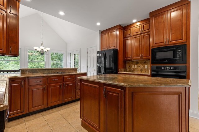 9539 Shadow Crossing Ln, Chattanooga, TN 37421 - kitchen with black appliances, tasteful backsplash, light tile patterned floors, lofted ceiling, and a chandelier