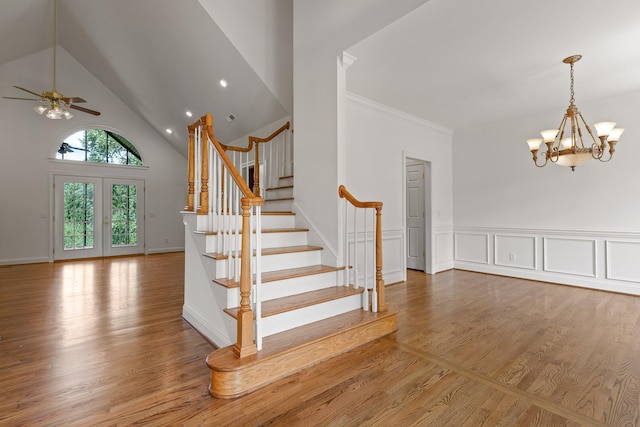 9539 Shadow Crossing Ln, Chattanooga, TN 37421 - stairway with a chandelier, wood finished floors, high vaulted ceiling, ceiling fan, and ornamental molding