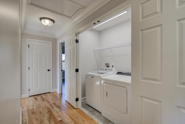 6253 River Stream Dr, Harrison, TN 37341 - laundry area with washer and clothes dryer, light wood-style floors, and crown molding