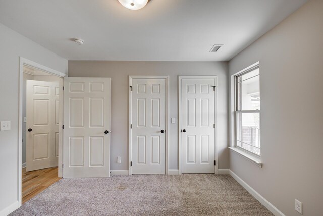 6253 River Stream Dr, Harrison, TN 37341 - unfurnished bedroom featuring two closets and light colored carpet