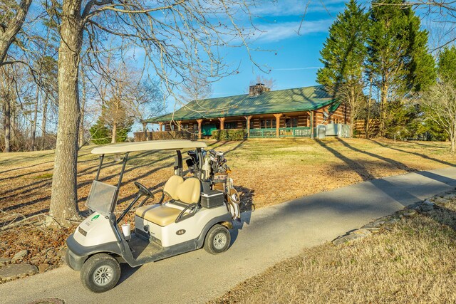 6253 River Stream Dr, Harrison, TN 37341 - view of front of property with a porch, a chimney, a metal roof, and a front lawn
