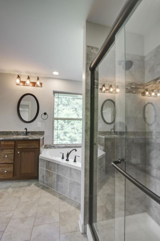 6253 River Stream Dr, Harrison, TN 37341 - bathroom featuring vanity, a bath, and a shower stall