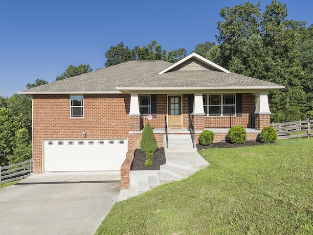6253 River Stream Dr, Harrison, TN 37341 - view of front facade with concrete driveway, an attached garage, brick siding, and roof with shingles