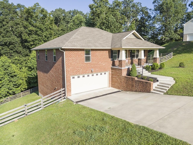 6253 River Stream Dr, Harrison, TN 37341 - view of front of property featuring brick siding, driveway, an attached garage, roof with shingles, and a porch