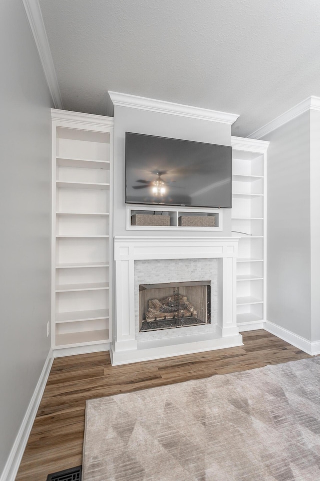 846 Altamont Rd, Chattanooga, TN 37415 - detailed view of crown molding, a fireplace, wood finished floors, and built in shelves