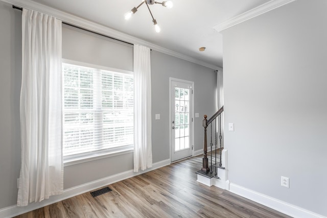 846 Altamont Rd, Chattanooga, TN 37415 - entryway featuring ornamental molding, wood finished floors, stairs, and a chandelier