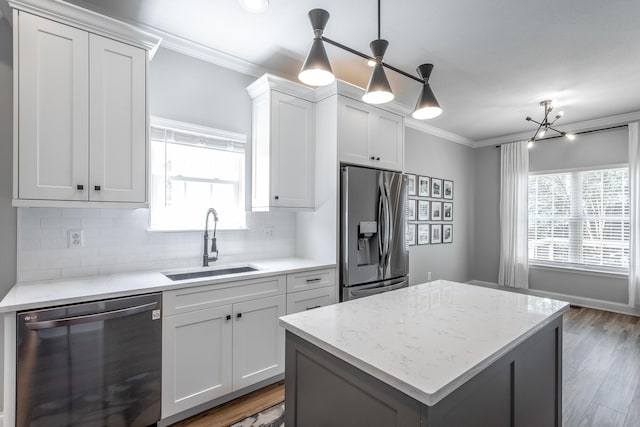 846 Altamont Rd, Chattanooga, TN 37415 - kitchen with appliances with stainless steel finishes, crown molding, tasteful backsplash, and plenty of natural light