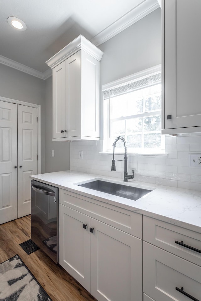 846 Altamont Rd, Chattanooga, TN 37415 - kitchen with dishwasher, crown molding, wood finished floors, white cabinets, and tasteful backsplash