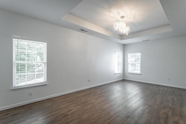 846 Altamont Rd, Chattanooga, TN 37415 - empty room featuring a chandelier, a raised ceiling, and dark wood-style flooring