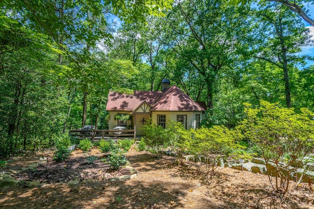 2 Mother Goose Vlg, Lookout Mountain, GA 30750 - view of front of house featuring a deck, stucco siding, and a chimney