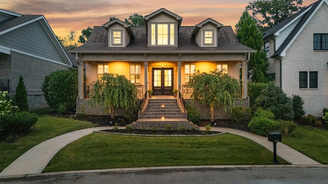 9253 Skyfall Dr, Ooltewah, TN 37363 - view of front of property featuring french doors, a porch, a front yard, and stairs