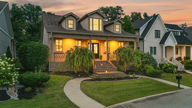 9253 Skyfall Dr, Ooltewah, TN 37363 - view of front of home with stairway, a porch, a lawn, and stucco siding