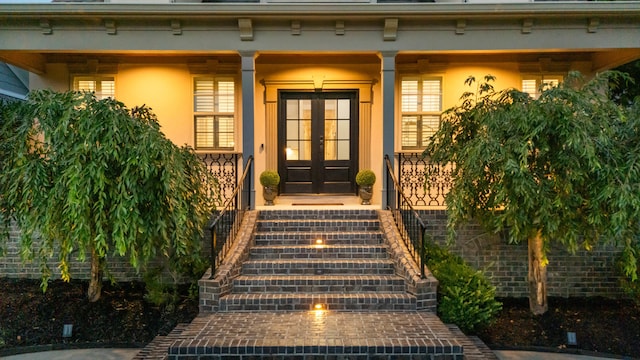 9253 Skyfall Dr, Ooltewah, TN 37363 - doorway to property featuring french doors, stucco siding, a porch, and mansard roof