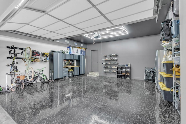 9253 Skyfall Dr, Ooltewah, TN 37363 - garage featuring freestanding refrigerator