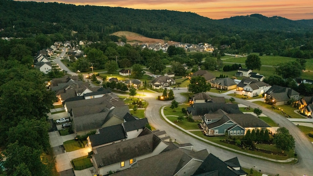 9253 Skyfall Dr, Ooltewah, TN 37363 - aerial view at dusk of a wooded view and a residential view
