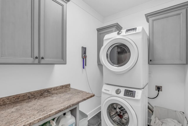 9253 Skyfall Dr, Ooltewah, TN 37363 - laundry room featuring cabinet space and estacked washer and dryer