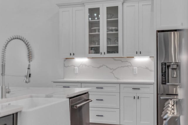 9253 Skyfall Dr, Ooltewah, TN 37363 - kitchen featuring stainless steel appliances, tasteful backsplash, white cabinets, and glass insert cabinets
